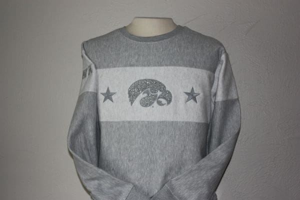 A gray sweatshirt with an iowa hawkeye on it.