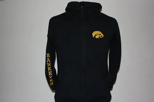 A black hoodie with the university of iowa logo on it.
