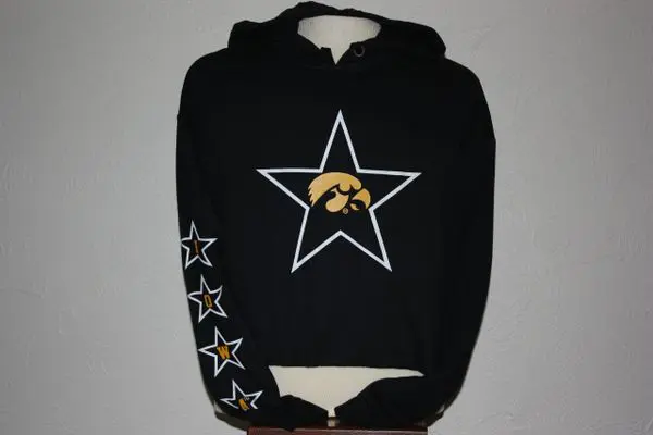 A black hoodie with a yellow and white star on it.