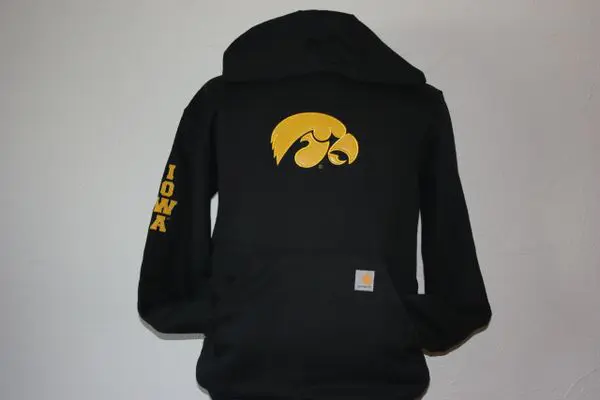A black hoodie with the university of iowa logo on it.