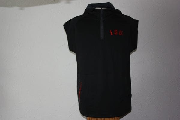 A black hooded sweatshirt hanging on the wall.